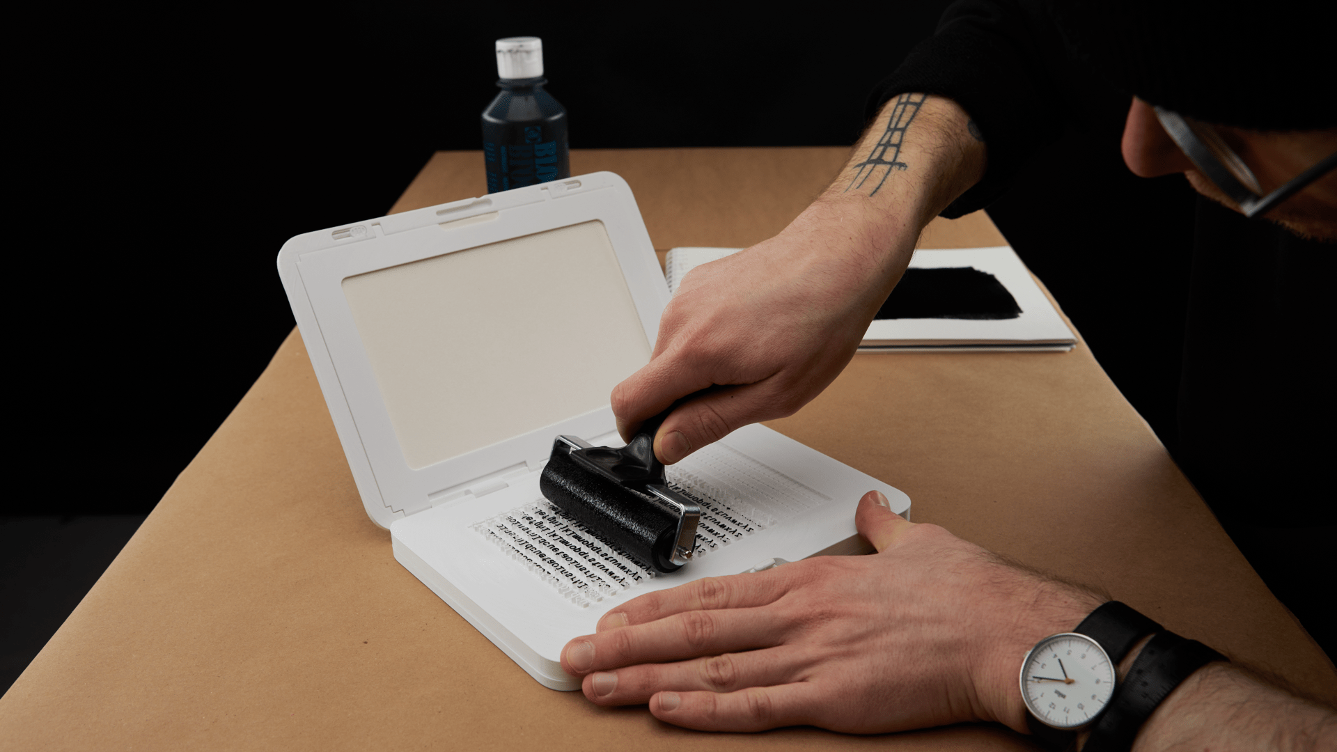 Rolling ink on the Zine Machine